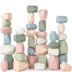 Pastel-colored geometric stone blocks stacked on a white background