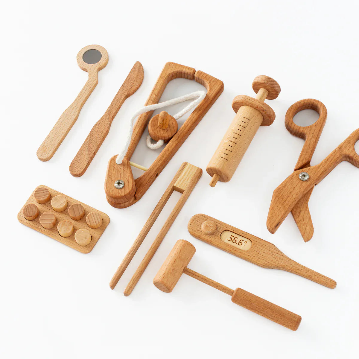 Set of wooden kitchen tools on a white background