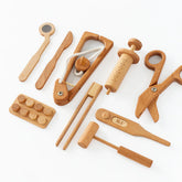 Set of wooden kitchen tools on a white background
