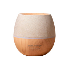 Wooden diffuser with beige top on a white background