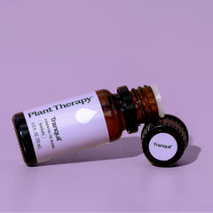 Plant Therapy Tranquil essential oil bottle on a purple background