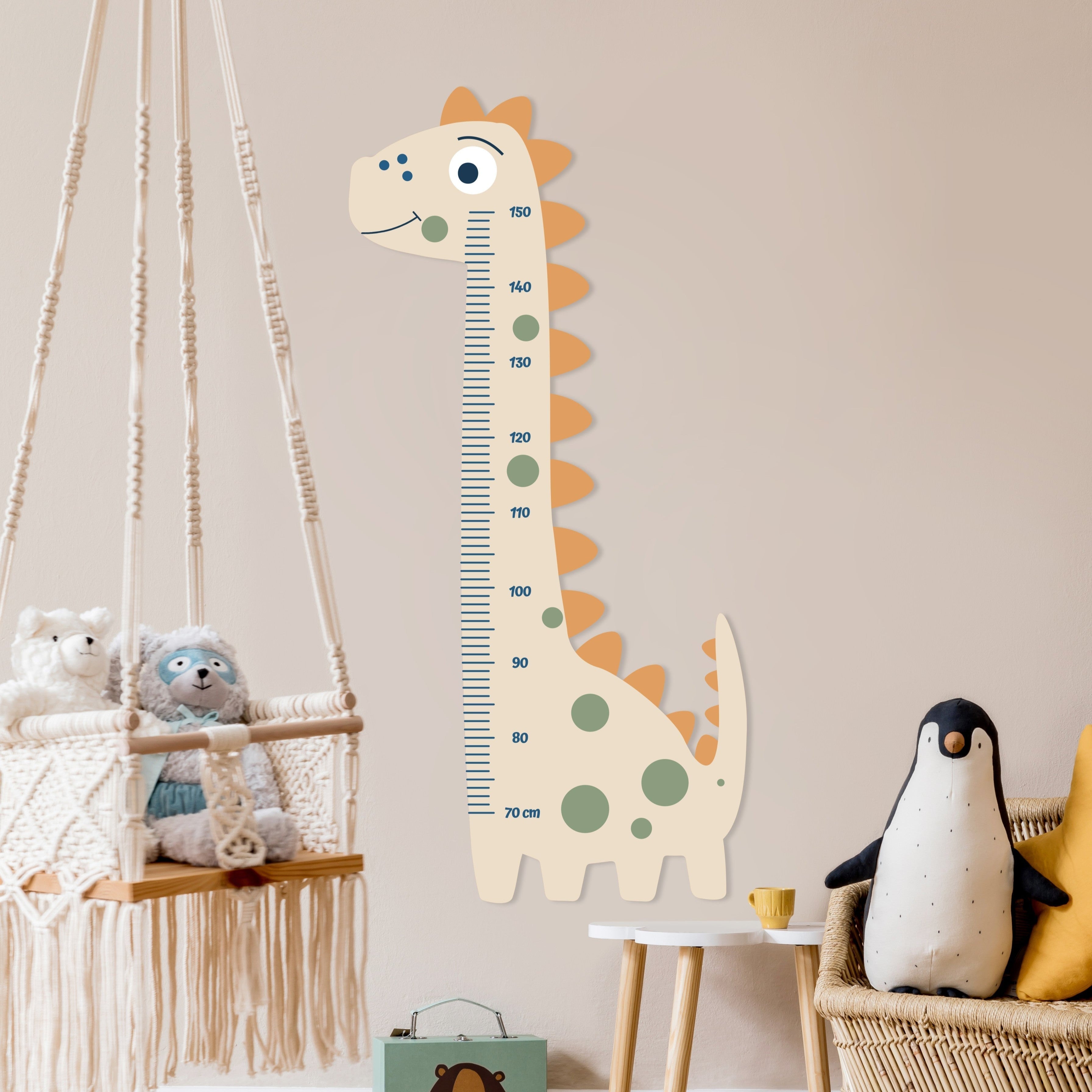 Children's room with a dinosaur-shaped growth chart, stuffed animals, and a hanging macramé swing.