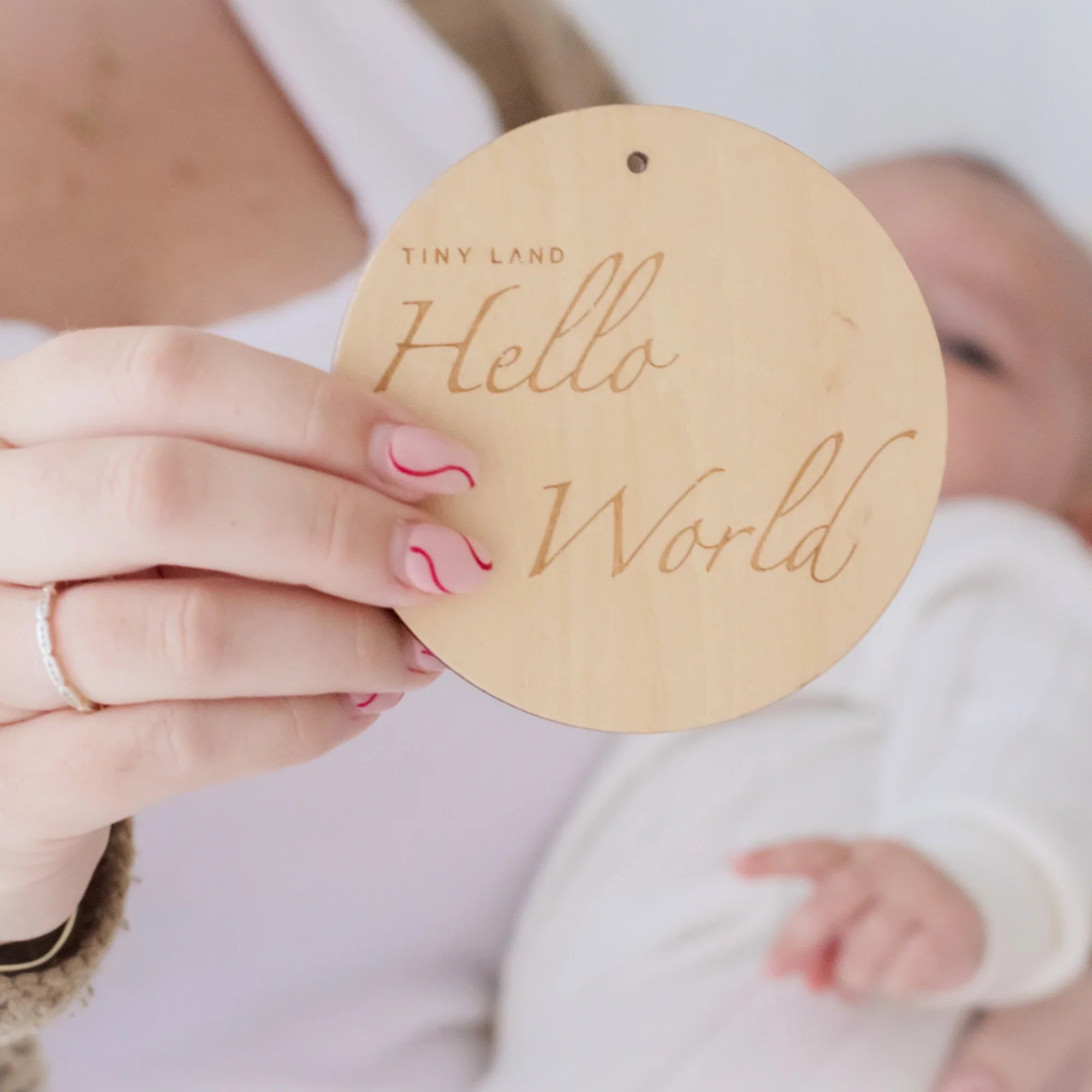 Close up of wooden tag that reads Hello World