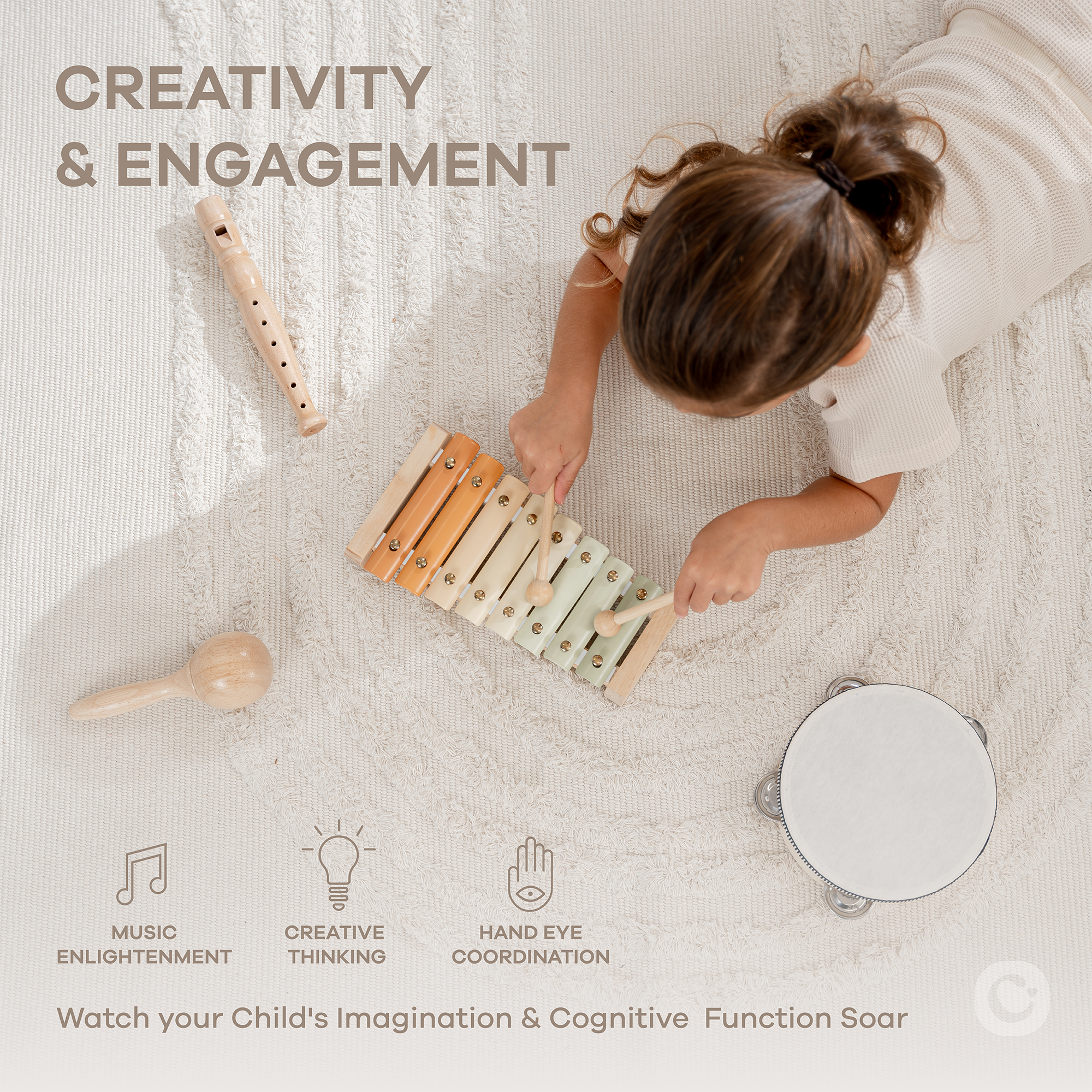 Child playing with wooden musical instruments on a textured surface, emphasizing creativity and engagement.