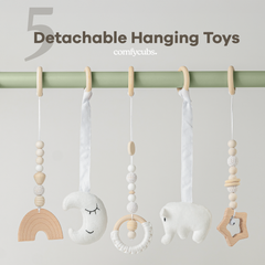Set of detachable hanging toys on a rod with 'comlycubs' branding.