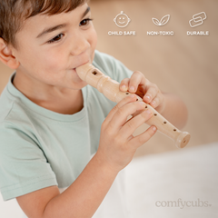 Child playing a wooden flute with 'comfyCubs' branding and product features displayed.