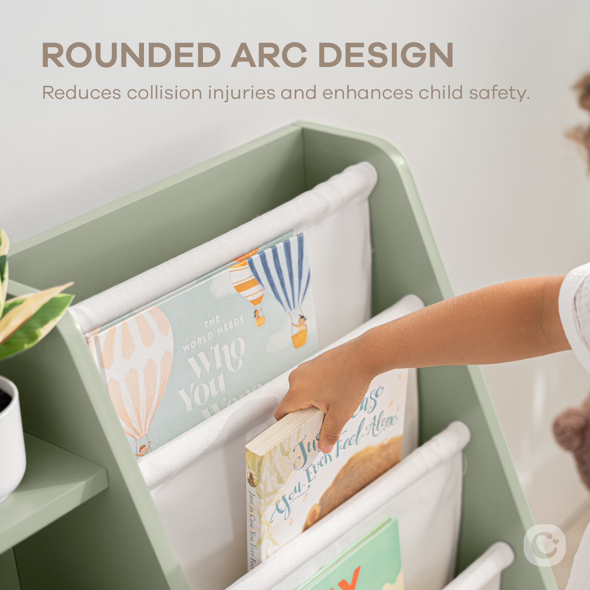Close-up of sage kids bookshelf showing fabric storage bins and wooden shelf structure