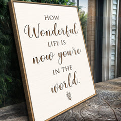 Framed print with motivational quote on a wooden surface