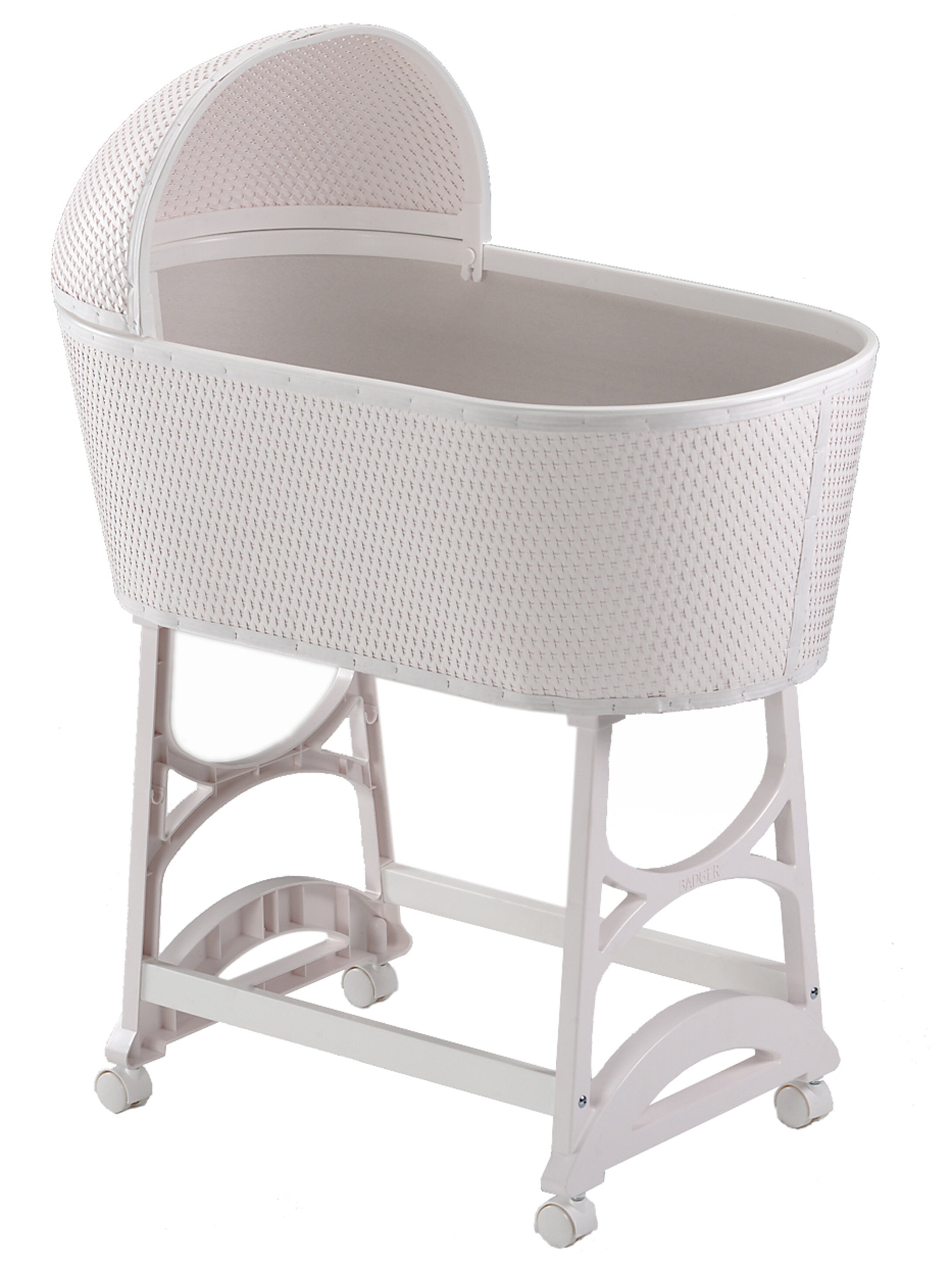 White wicker baby bassinet on a white background