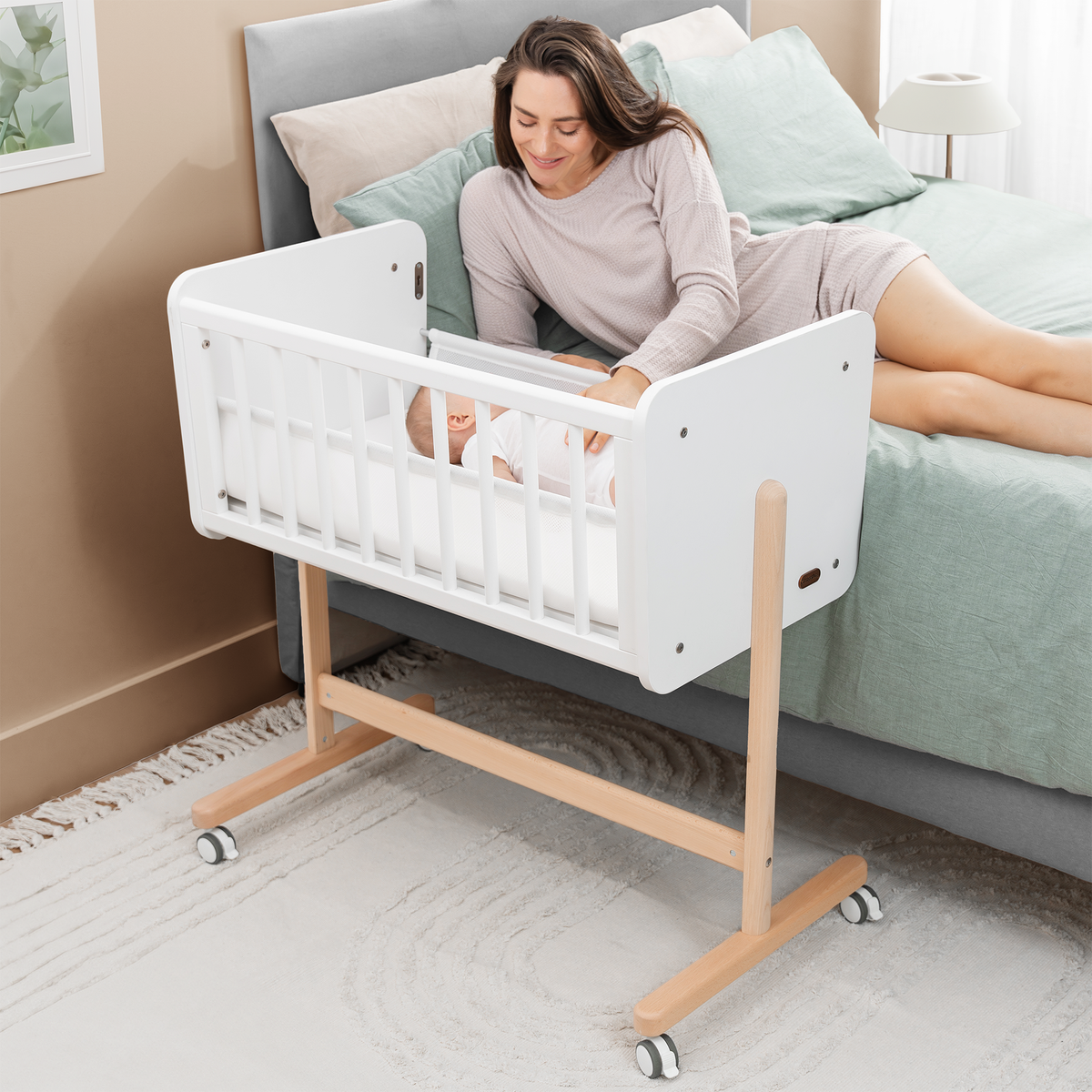 Woman interacting with a baby crib in a bedroom setting
