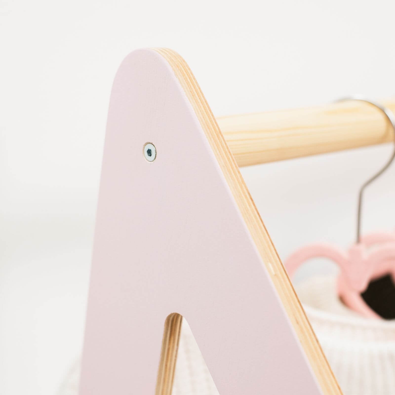 Pink and gold children's chair with a blurred background