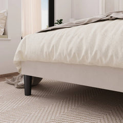 Bed with white bedding in a bedroom setting