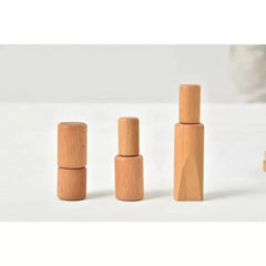 Set of wooden cylindrical objects on a white background