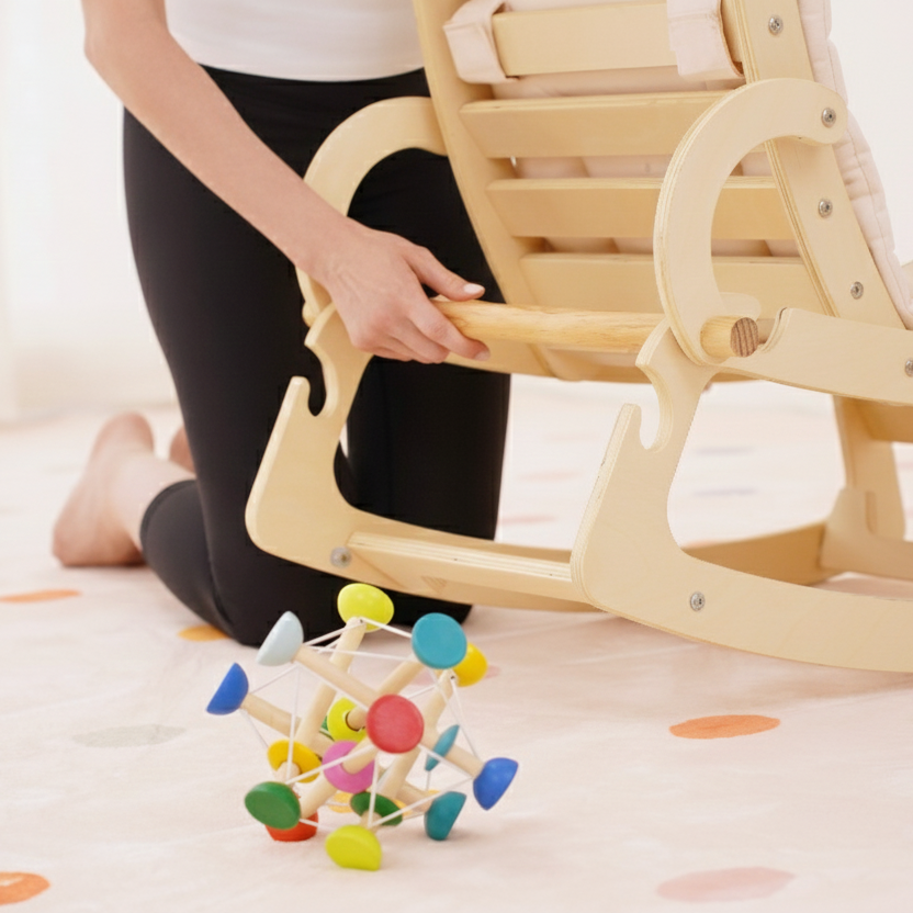 Child playing with a colorful wooden toy on a light-colored floor.