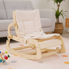 Wooden rocking chair with a white cushion in a living room setting.