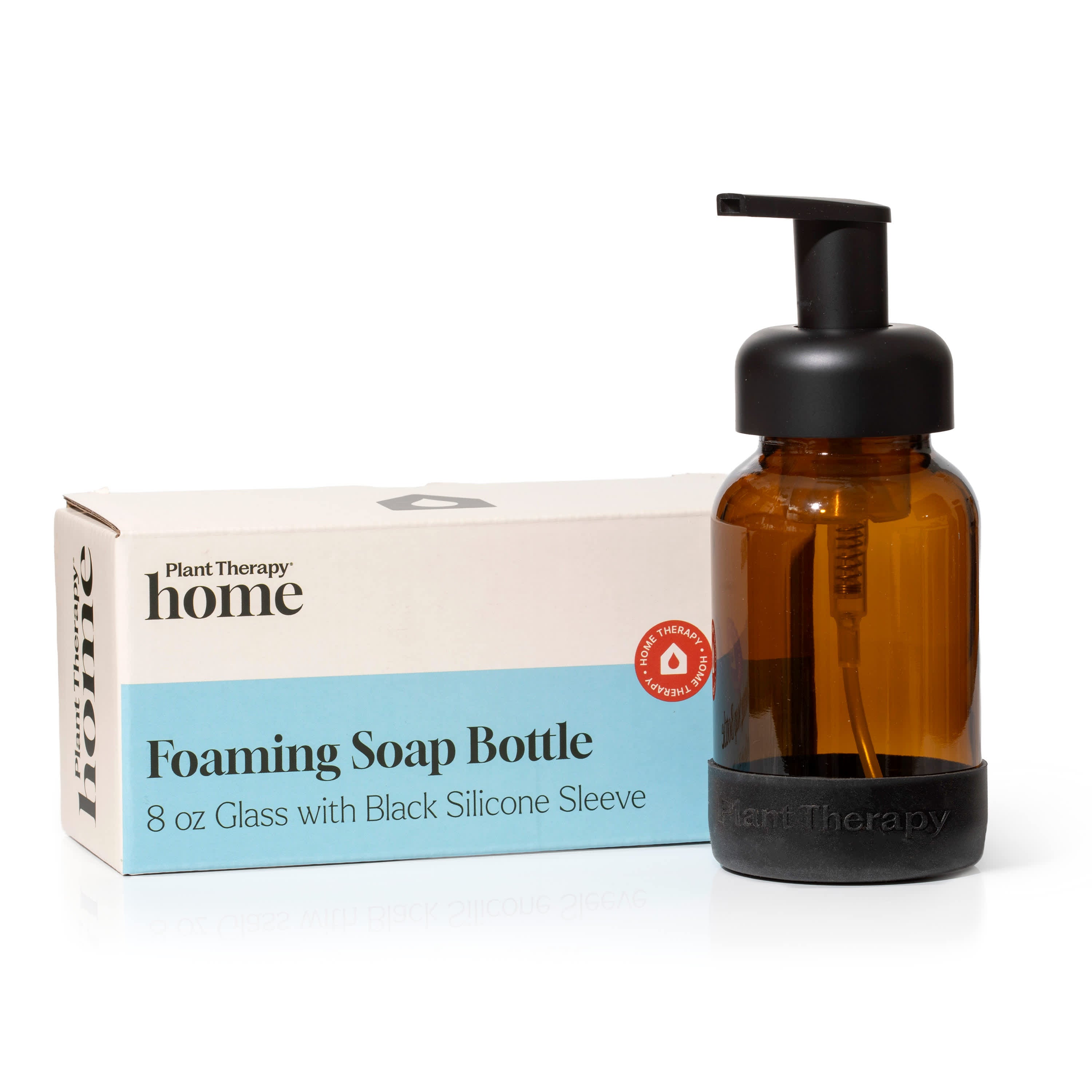 Brown foaming soap bottle with black pump and packaging on a white background