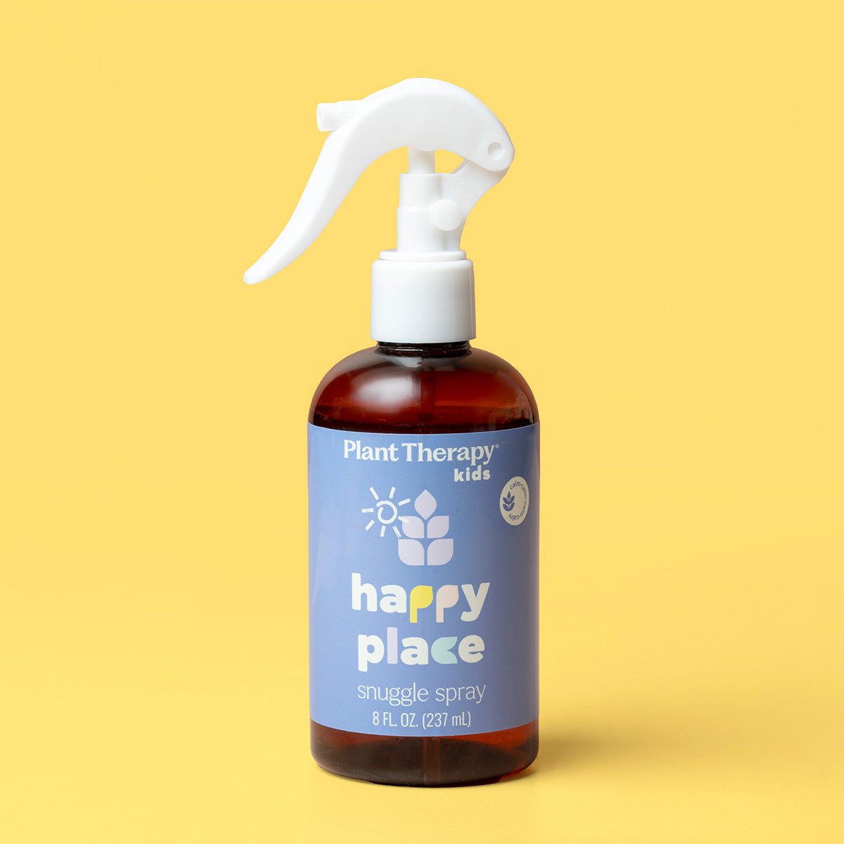 Bottle of Plant Therapy Kids 'happy place' snuggle spray on a yellow background