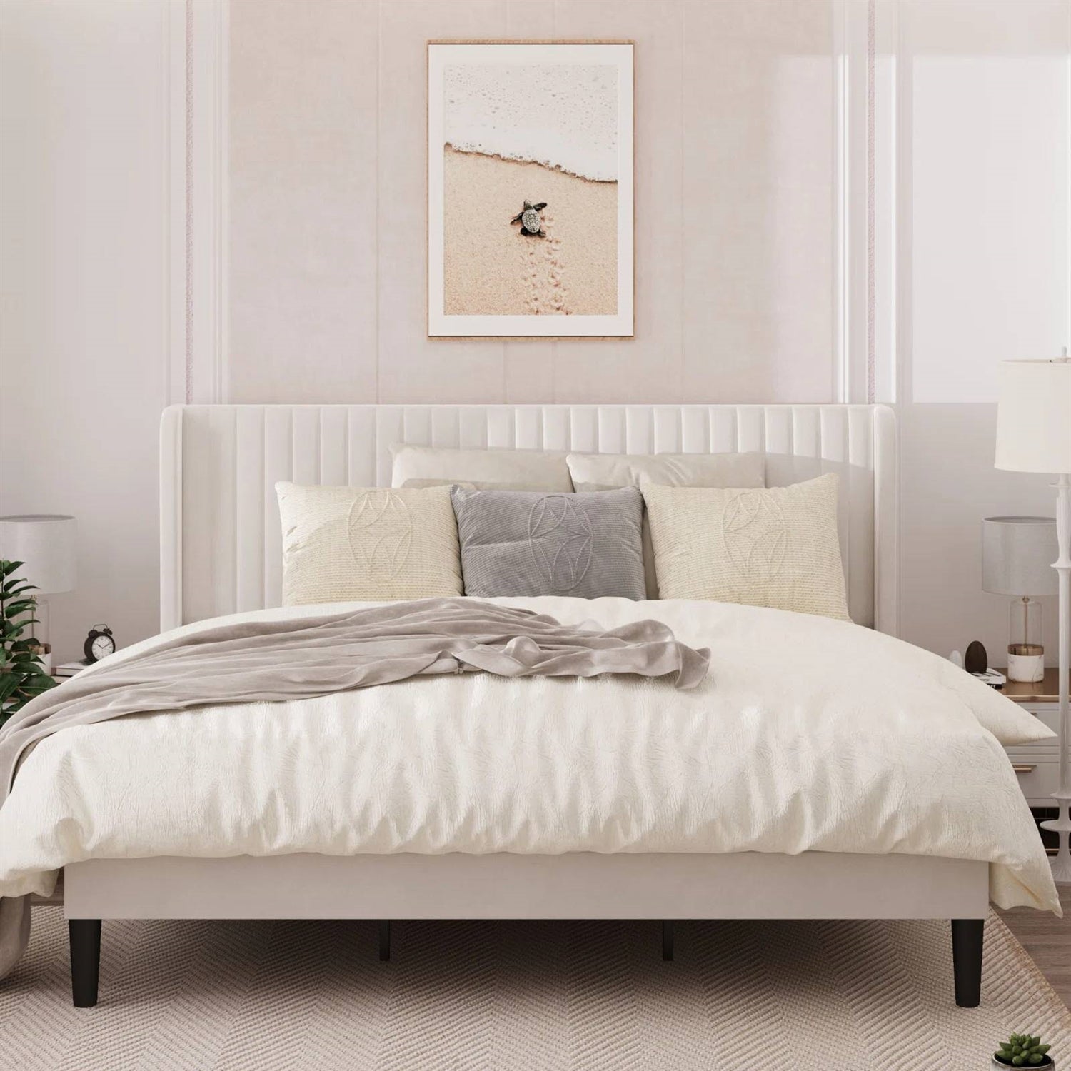 Neatly made bed with white bedding and decorative pillows in a bedroom setting.