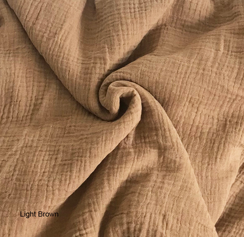 Close-up of light brown fabric with a textured pattern