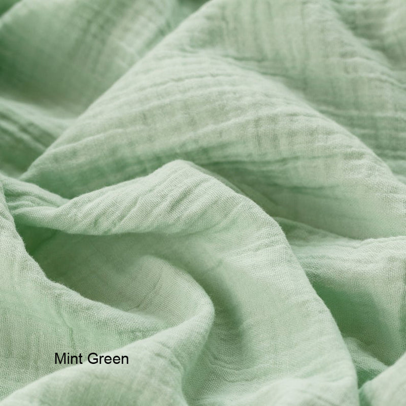 Close-up of mint green fabric with 'Mint Green' label.