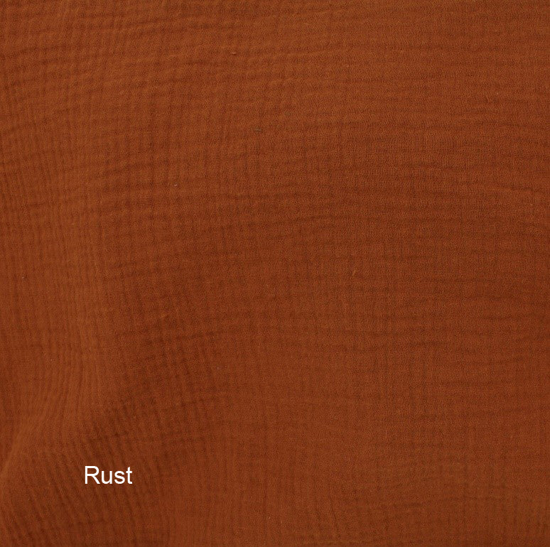 Solid rust-colored fabric texture with 'Rust' label
