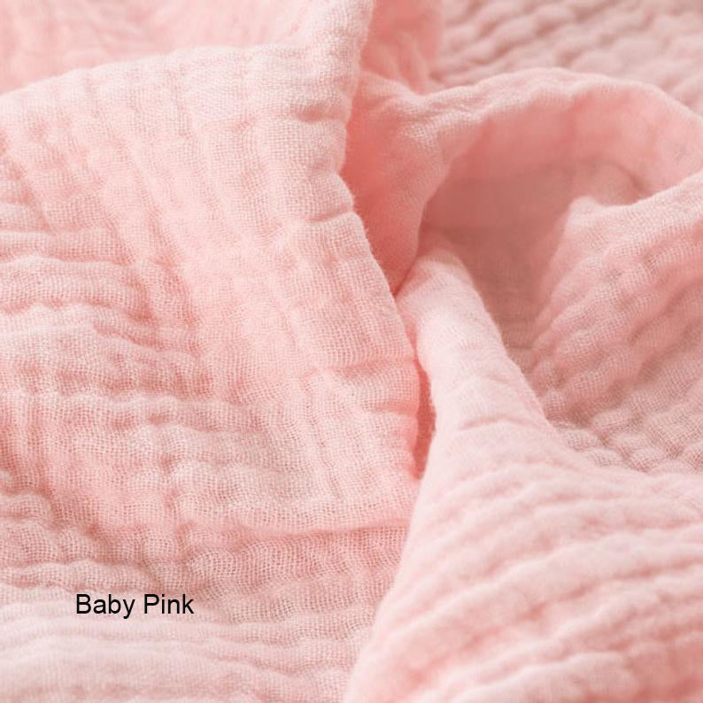 Close-up of baby pink textured fabric with 'Baby Pink' label.