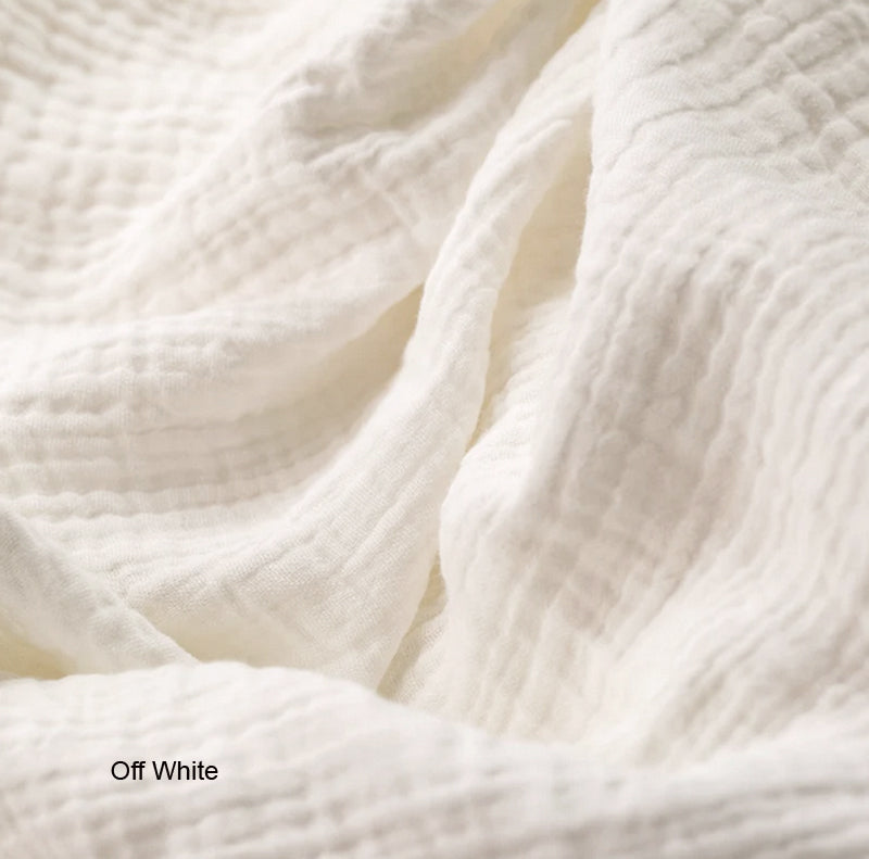 Close-up of off-white fabric with a soft texture