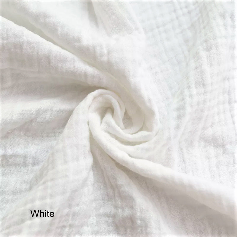 Close-up of white fabric with a swirled pattern