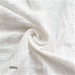 Close-up of white fabric with a swirled pattern