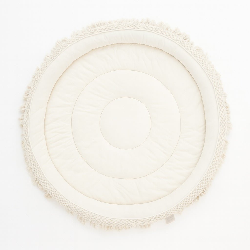 Round woven mat with a textured border on a white background