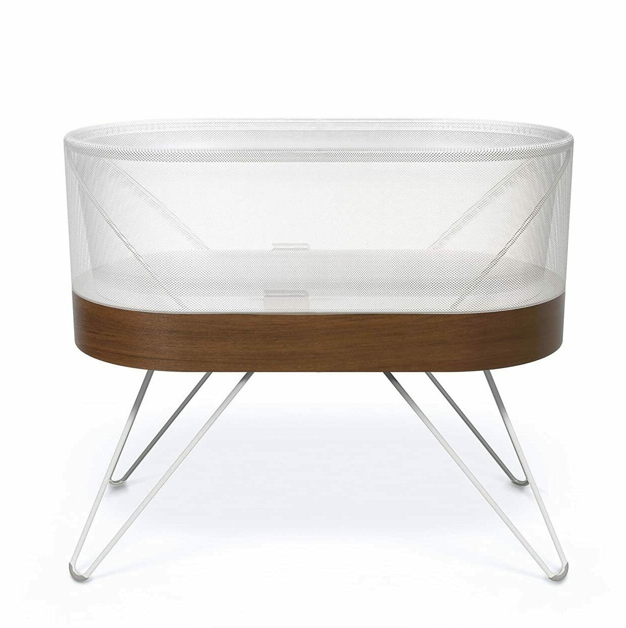 Wooden crib with mesh side on a white background