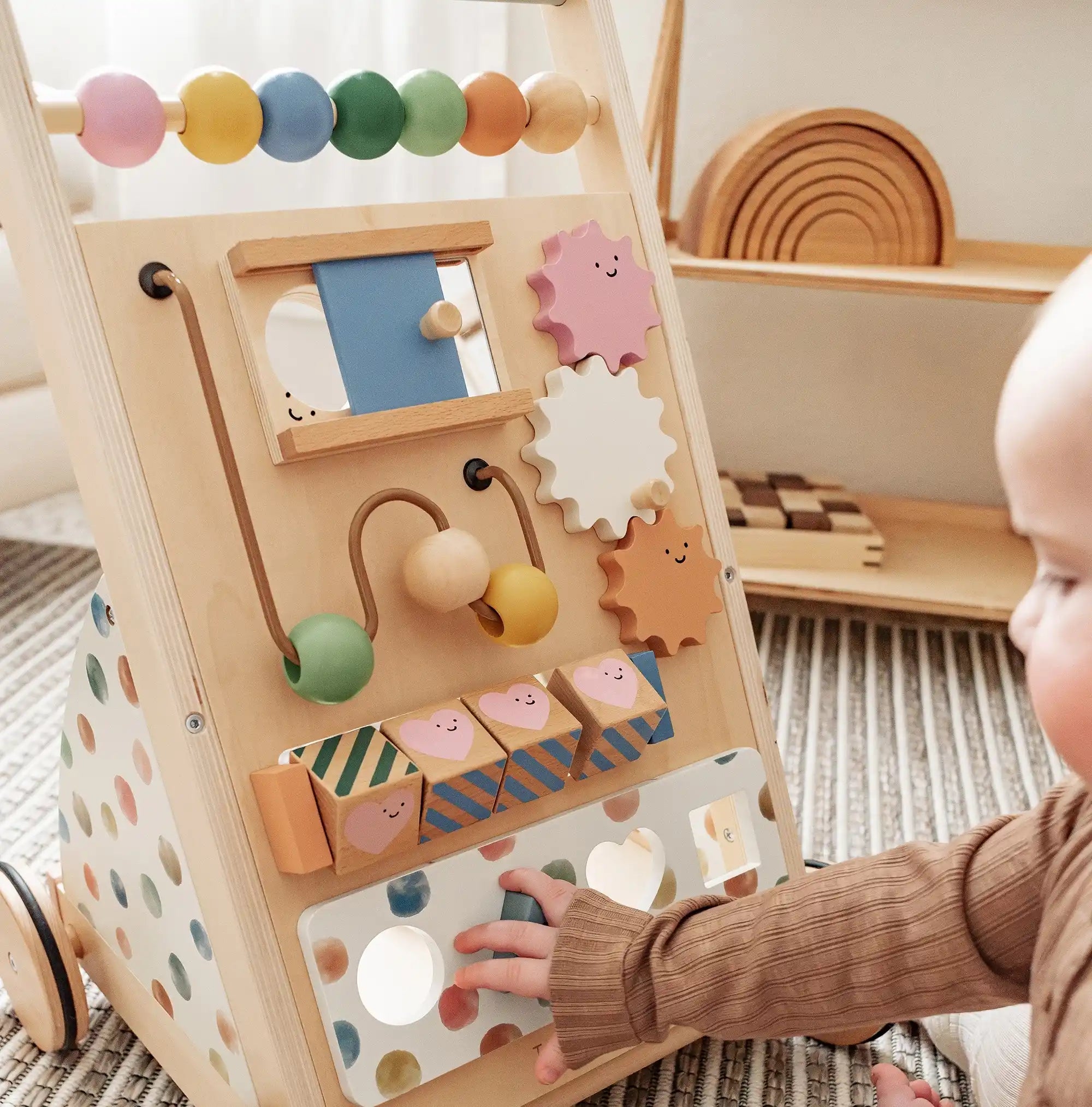 Child playing with activity walker