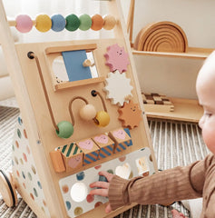 Child playing with activity walker