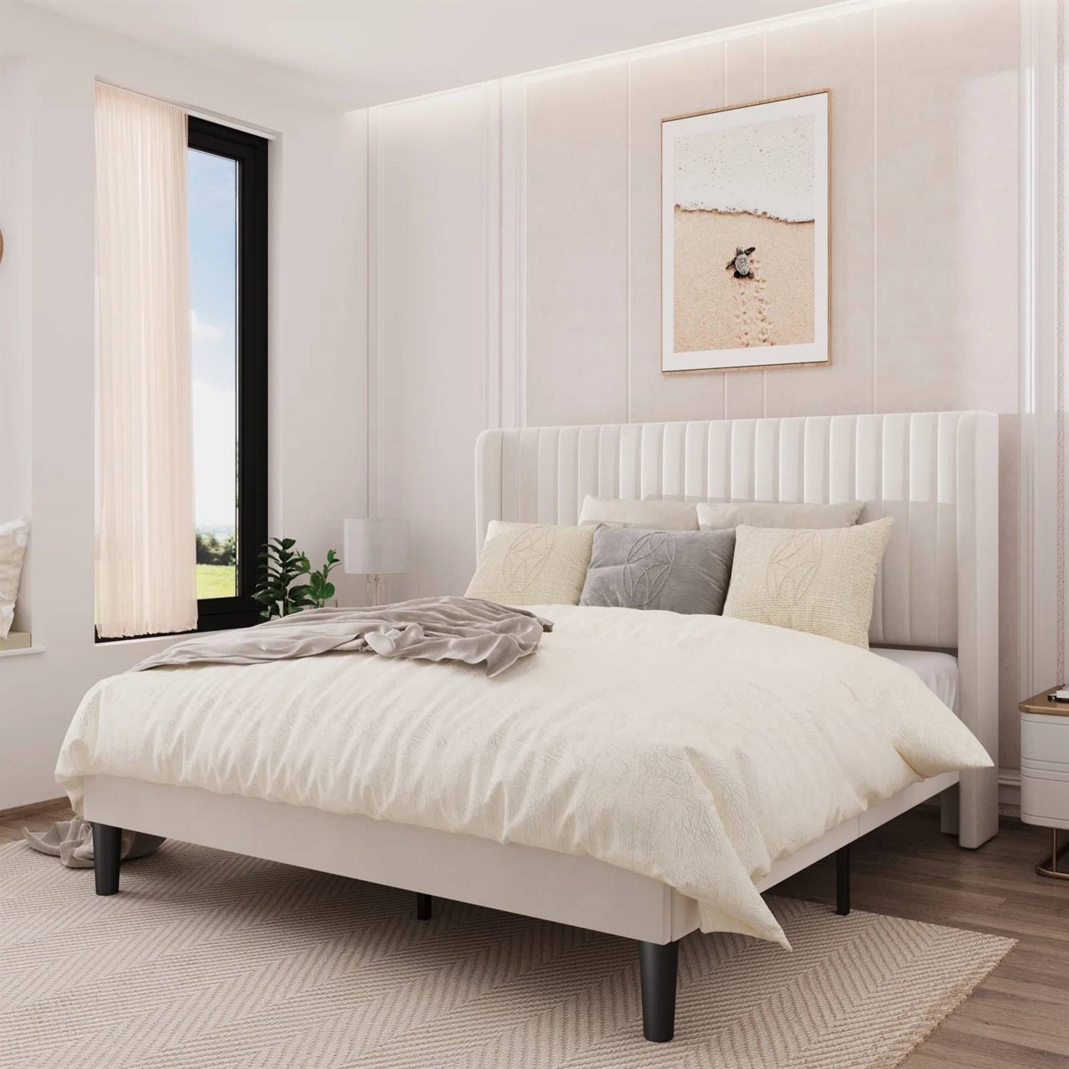 Neatly made bed in a modern bedroom with a window and framed picture on the wall.