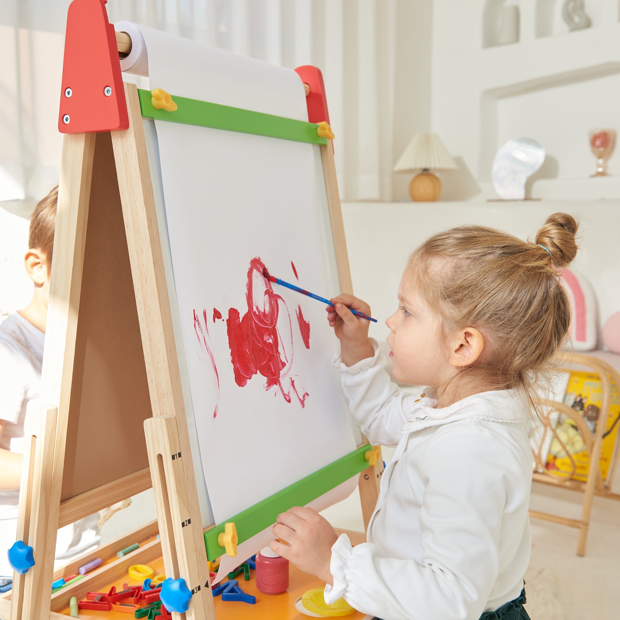 Safe paper cutter feature on Tiny Land 3-in-1 wooden art easel for mess-free creative play
