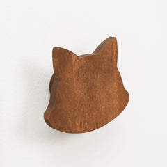 Wooden cat-shaped object on a white background