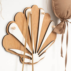 Wooden fan-shaped hook with ribbons on a white background