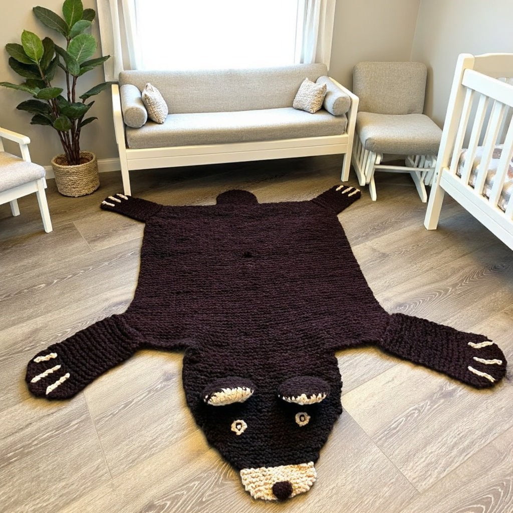 Baby on organic wool brown bear play mat in a calm neutral nursery setting