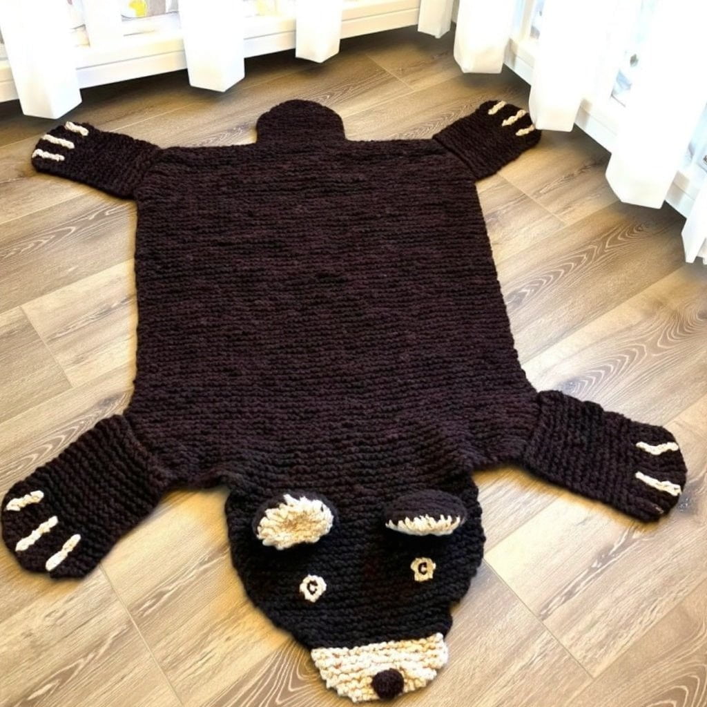 organic wool brown bear play mat in a calm neutral nursery setting