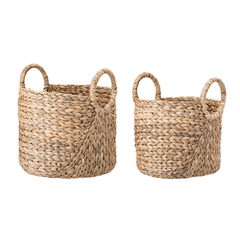 Two woven baskets with handles on a white background