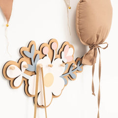 Decorative headband with floral design on a white background