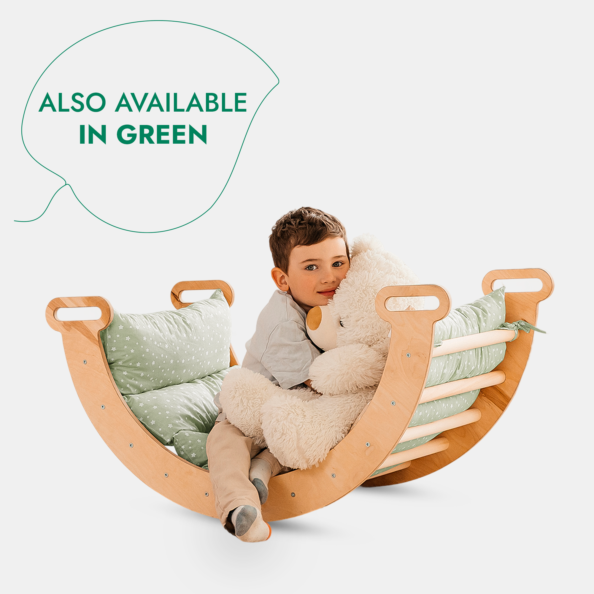child with teddy bear on a montessori arch