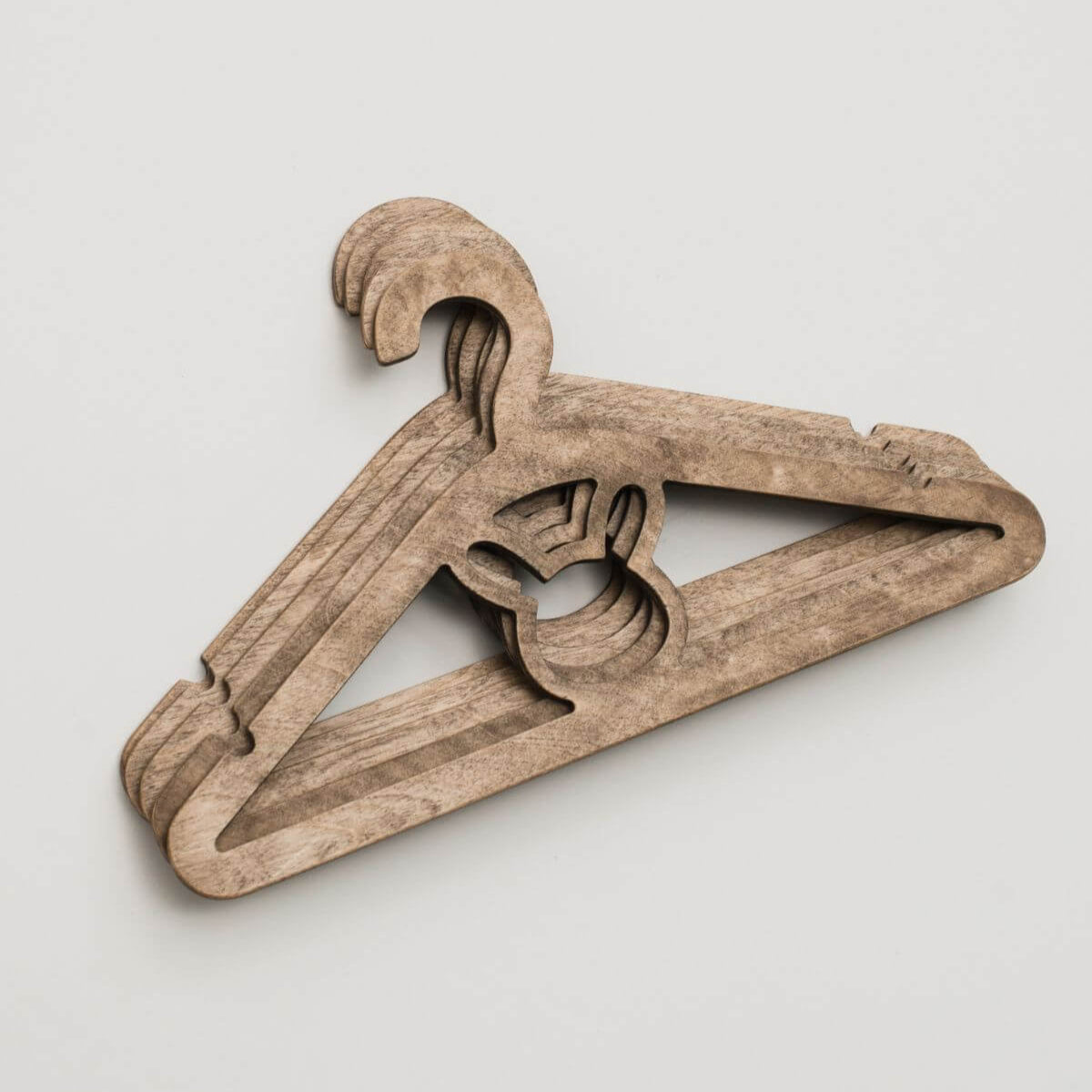 Wooden hanger on a light gray background