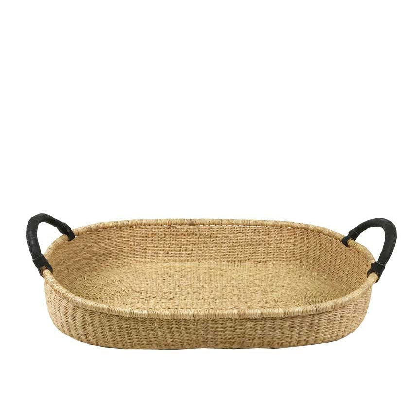 Woven tray with black handles on a white background
