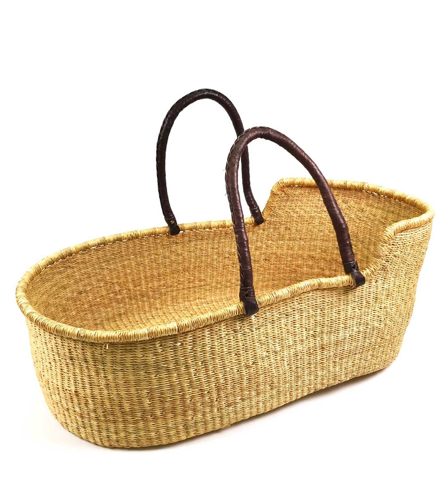 Wicker baby Moses basket with brown handles on a white background
