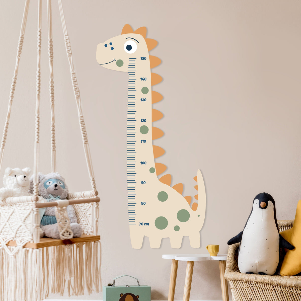 Children's room with a dinosaur-shaped growth chart, stuffed animals, and a hanging macramé swing.