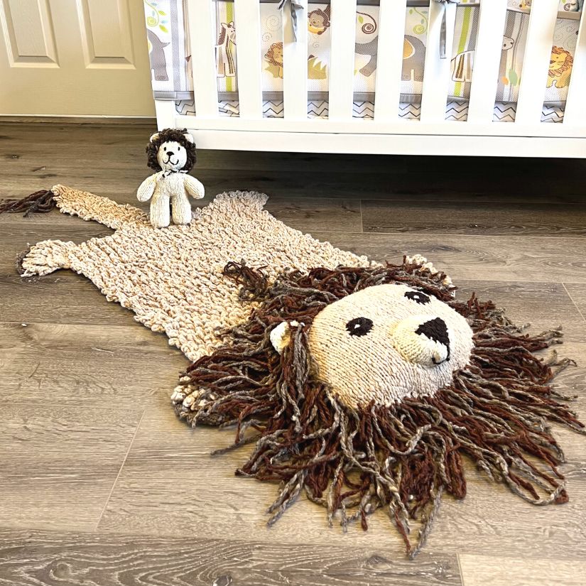 organic wool lion play mat in a calm neutral nursery setting