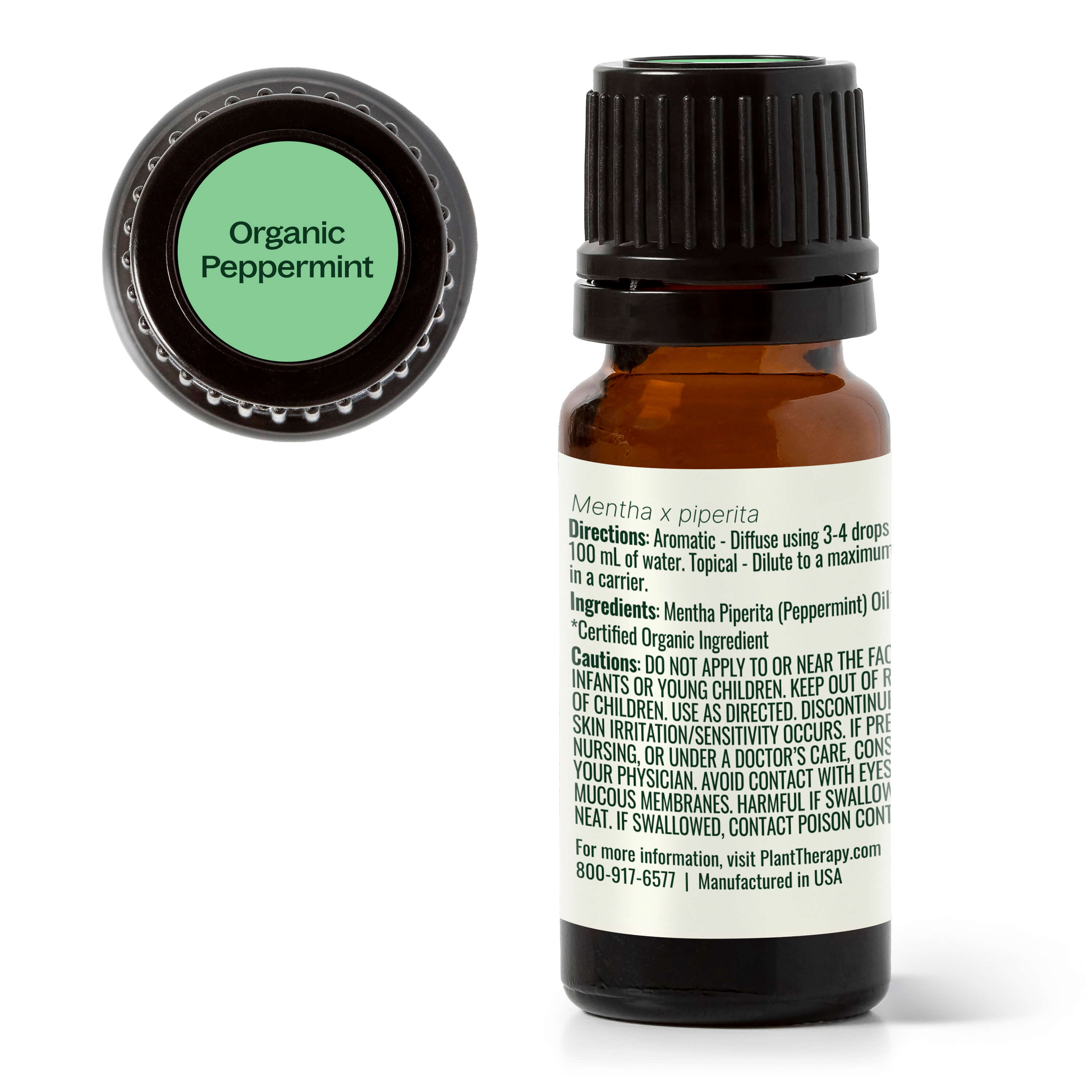 Organic peppermint essential oil bottle with label on a white background