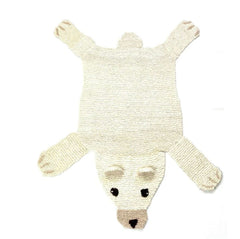 Organic wool polar bear nursery rug on white background showing hand-knit texture and design