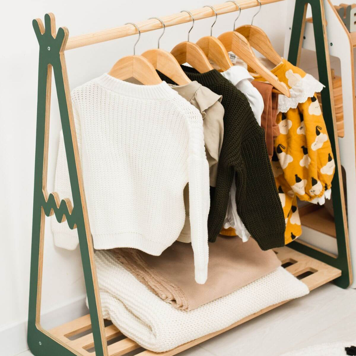 Clothing rack with clothes on a white background